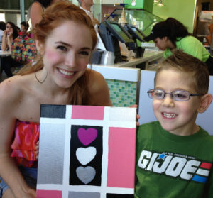 Jack-Hyatt delivers one of his painting to actress Spencer Locke