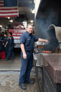 Firefighter Lance DeMello at the firehouse grill