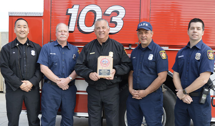 Steve Ruda at FS 103 with award for his dedication and devotion to the fire service core values. 