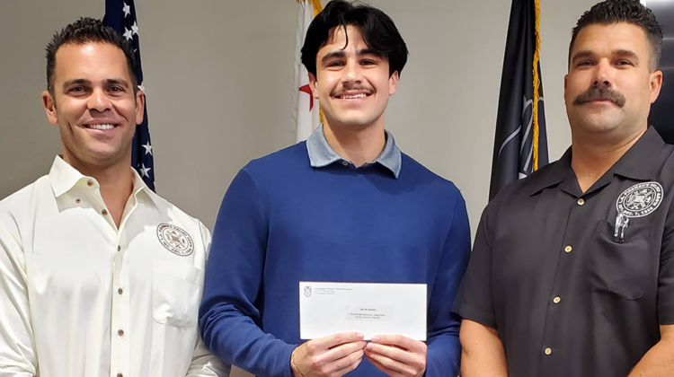 Jacob Munoz receives 25,000 Scholarship check